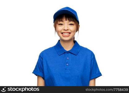 profession, job and people concept - happy smiling delivery woman in blue uniform over white background. happy smiling delivery woman in blue uniform