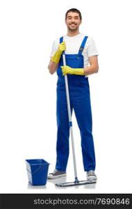 profession, service and people concept - happy smiling male worker or cleaner in overall and gloves cleaning floor with mop and bucket over white background. male cleaner cleaning floor with mop and bucket