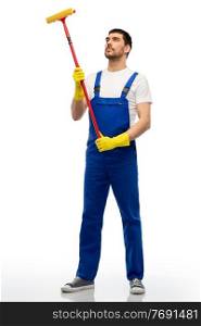 profession, service and people - male worker or cleaner in overal and gloves with window cleaning mop over white background. male cleaner in overal with window cleaning mop