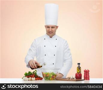 profession, vegetarian, food and people concept - happy male chef cooking salad over beige background
