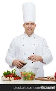 profession, vegetarian, food and people concept - happy male chef cooking vegetable salad