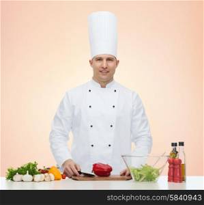 profession, vegetarian, food and people concept - happy male chef cooking vegetable salad over beige background