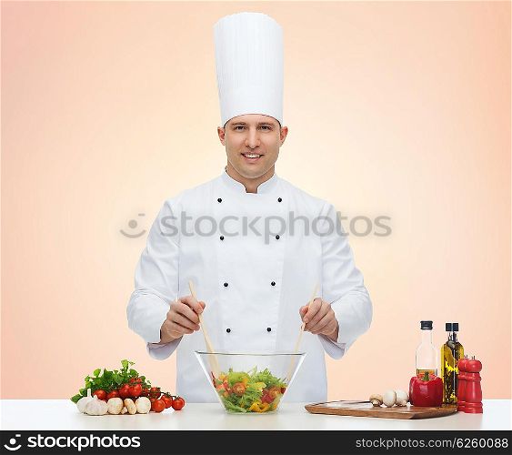 profession, vegetarian, food and people concept - happy male chef cooking vegetable salad over beige background