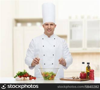 profession, vegetarian, food and people concept - happy male chef cooking vegetable salad over kitchen background