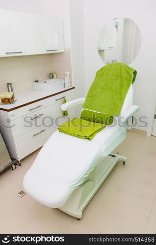 Profession workplace equipment concept. Professional clean chair in beautician spa salon ready for next client.. Professional chair in beautician spa salon