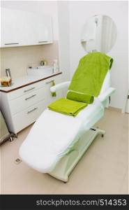 Profession workplace equipment concept. Professional clean chair in beautician spa salon ready for next client.. Professional chair in beautician spa salon
