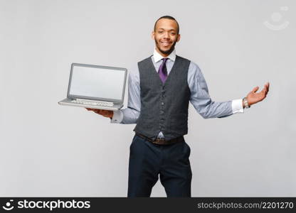 professional african-american business man holding laptop computer.. professional african-american business man holding laptop computer