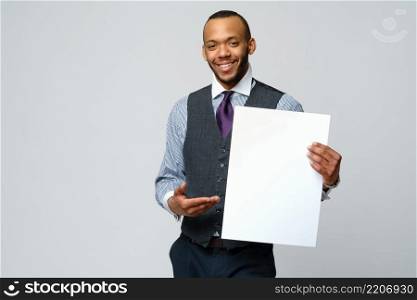 professional african-american business man - presenting holding blank sign.. professional african-american business man - presenting holding blank sign
