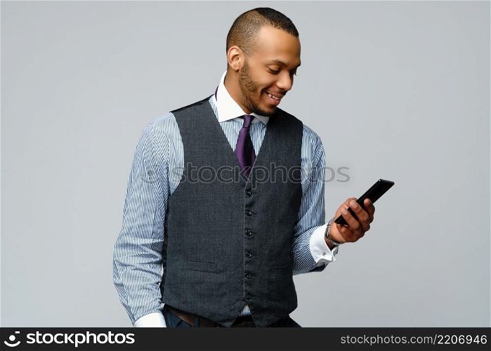 professional african-american business man talking on mobile cell phone. professional african-american business man talking on mobile phone
