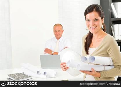 Professional architect woman attractive with blueprint in office