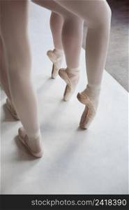 professional ballet dancers training together while wearing pointe shoes