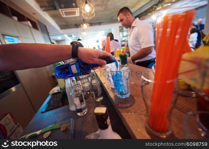 professional barman prepare fresh coctail drink and representing nightlife and party event concept