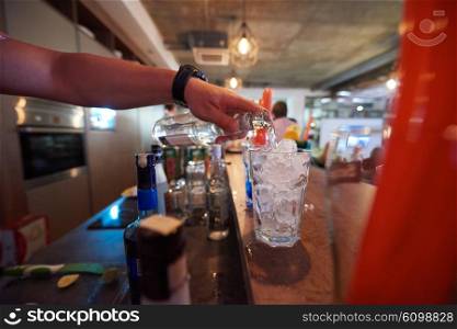 professional barman prepare fresh coctail drink and representing nightlife and party event concept