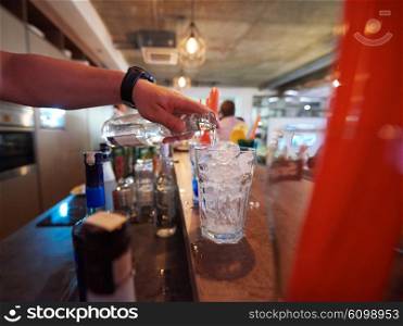 professional barman prepare fresh coctail drink and representing nightlife and party event concept