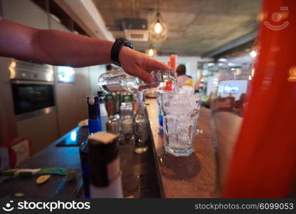 professional barman prepare fresh coctail drink and representing nightlife and party event concept