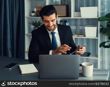 Professional businessman in black suit, present financial data or BI paper via laptop during online meeting. Remote work concept with virtual meeting presentation of effectiveness remote work. Fervent. Businessman present BI paper during online meeting. Fervent