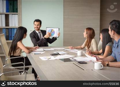 professional businessman present financial chart with team in the meeting, selective focus