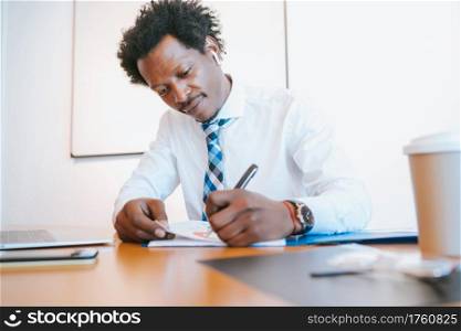Professional businessman working at his modern office. Business and success concept.