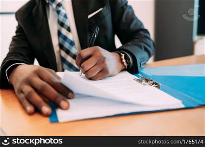 Professional businessman working with documents at his modern office. Business concept.