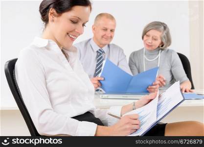 Professional businesswoman attractive sitting by office desk