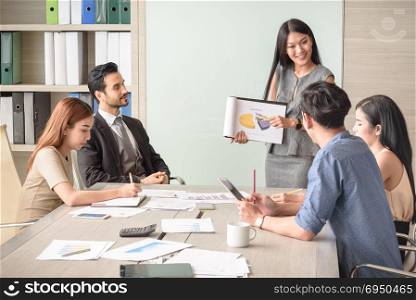 professional businesswoman present financial chart with team in the meeting