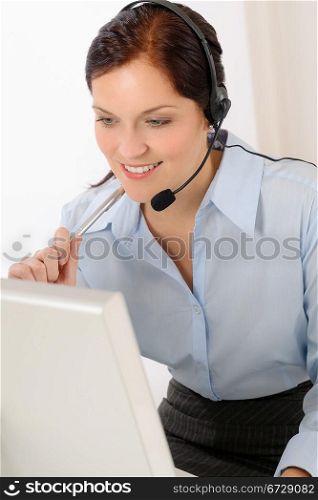 Professional call center representative woman look computer wear headphones