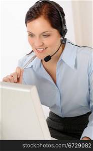 Professional call center representative woman look computer wear headphones