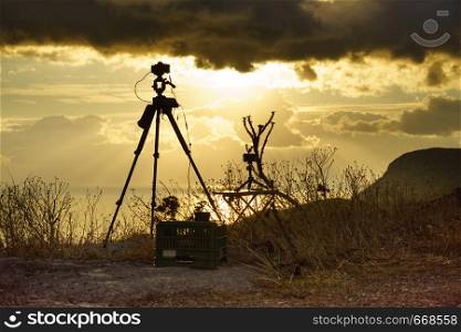 Professional camera taking picture film video of sunrise over sea surface, Greece Peloponnese Mani Peninsula.. Camera taking picture film of sunrise over sea surface