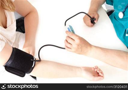 Professional check of blood pressure in a medical study.