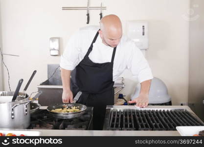 professional chef cleaning the kitchen