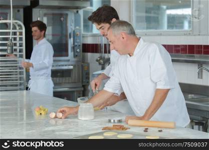Professional chefs making pastry