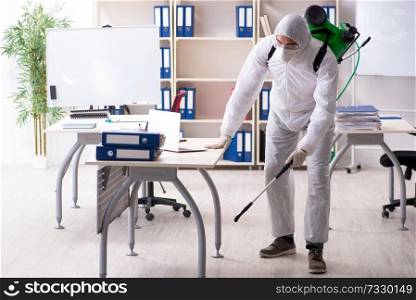 Professional contractor doing pest control at office