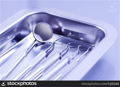Professional dental tools. Professional dental tools in a sterile medical light