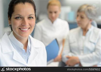 Professional dentist woman nurse with patient woman dental surgery