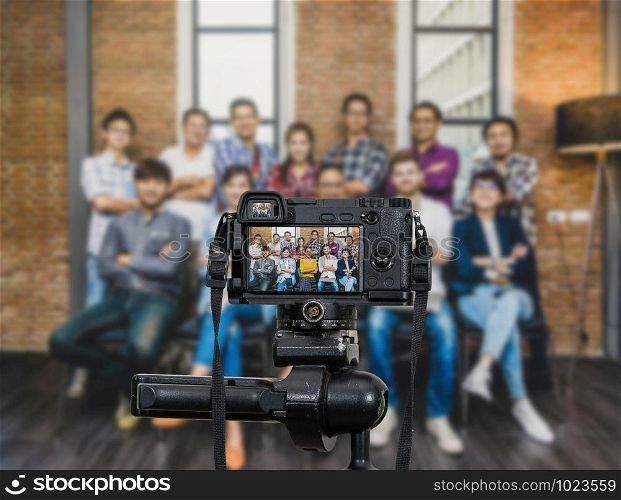 Professional digital Mirrorless camera with microphone recording video blog of Group Asian and Multiethnic Business people with casual suit, Camera for photographer or Video and Live Streaming concept