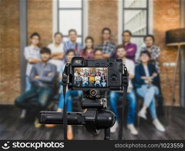 Professional digital Mirrorless camera with microphone recording video blog of Group Asian and Multiethnic Business people with casual suit, Camera for photographer or Video and Live Streaming concept