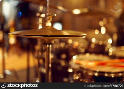 Professional drum kit, cymbals closeup, nobody. Rock band concert repetition, live sound performing concept, percussion musical instrument. Professional drum kit, cymbals closeup, nobody