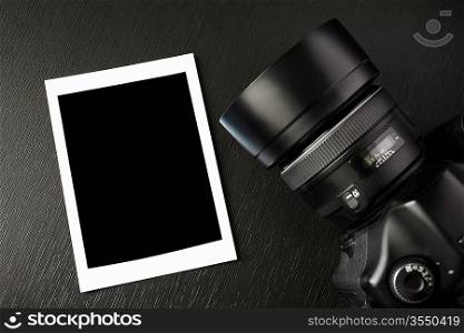 professional dslr camera and blank image on black background