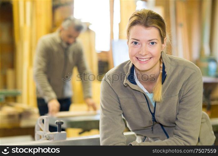 professional female carpenter worker looking at camera