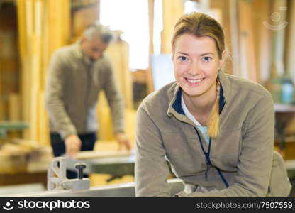 professional female carpenter worker looking at camera