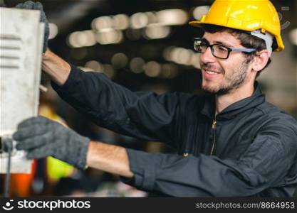 professional high skill young American new generation worker happy enjoy smiling to work in a heavy industrial factory machine control operator