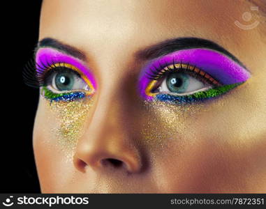 Professional Make up concept. Portrait of young beautiful woman with beauty makeup and perfect skin. Isolated on black background