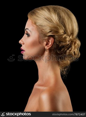 Professional Make up concept. Portrait of young beautiful woman with beauty makeup and perfect skin. Isolated on black background