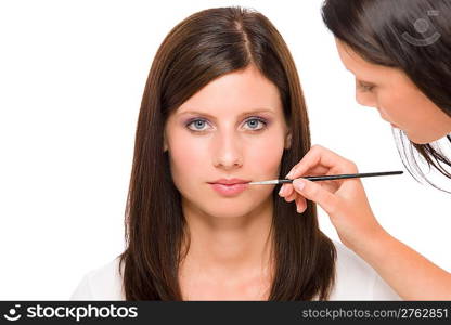 Professional makeup model portrait artist apply glossy lipstick using brush