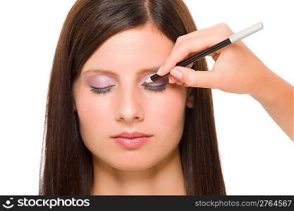 Professional makeup model portrait artist make eye lines using pencil