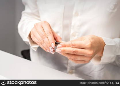 Professional manicurist preparing tools for doing clients nails. Professional manicurist preparing tools for doing clients nails.