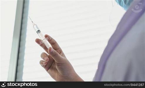 Professional medical asian woman doctor with Syringe medical injection in hand vaccine injecting health drug vaccination influenza fight against virus covid-19 Health care in hospital