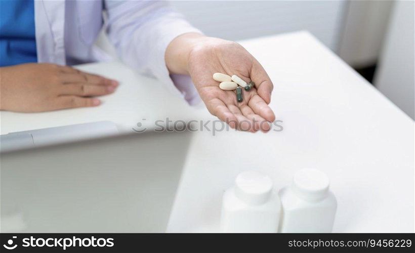 Professional medical doctor hand giving medicine. protect against coronavirus COVID-19 medicine healthcare concept doctor giving pills to patient.