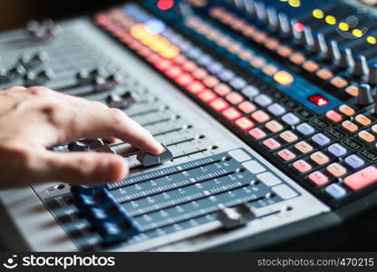 Professional music production in a sound recording studio, mixer desk