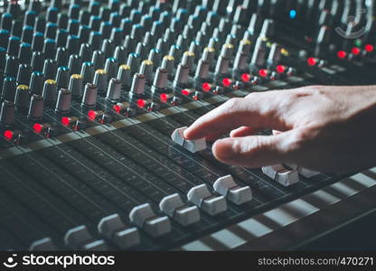 Professional music production in a sound recording studio, mixer desk